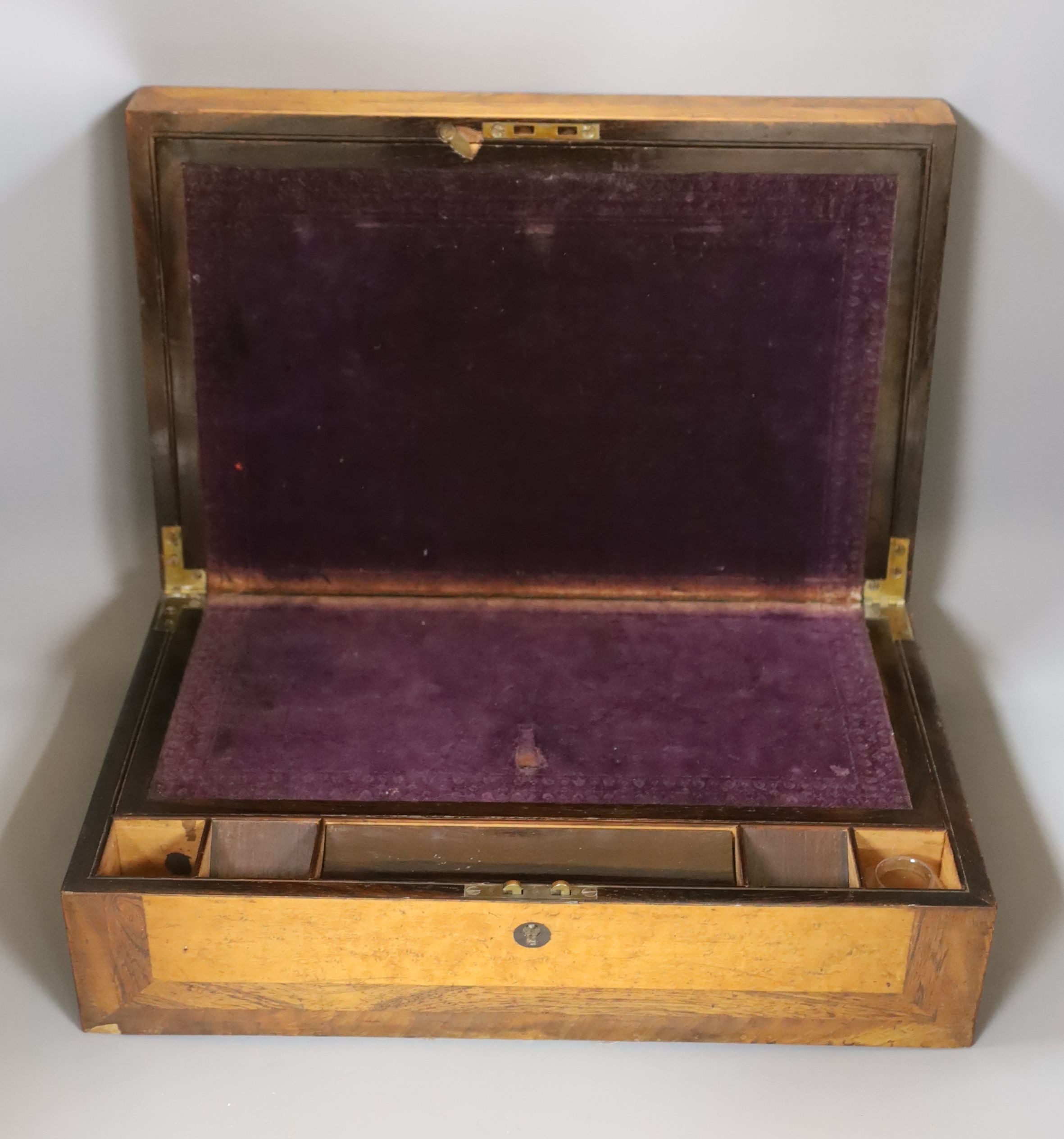 A Victorian birds eye maple and rosewood writing slope, 44.5 cms wide x 14 cms high.